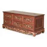 A PERANAKAN CARVED AND PARCEL GILT LOW SIDEBOARD