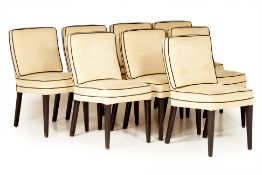 A SET OF EIGHT SUEDE DINING CHAIRS