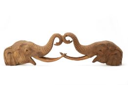 A THAI WOOD CARVING OF ELEPHANTS