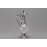 A SILVER MOUNTED GLASS CLARET JUG