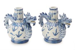 A PAIR OF CHINESE BLUE AND WHITE DRAGON EWERS