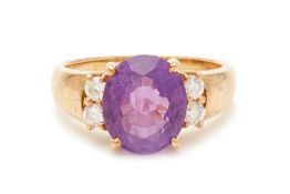 AN OVAL CUT AMETHYST AND DIAMOND RING