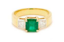 AN EMERALD AND DIAMOND RING