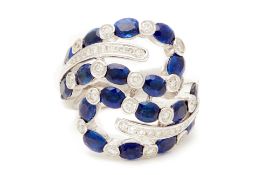 A SAPPHIRE AND DIAMOND RING