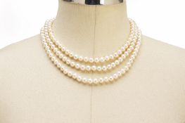 A THREE STRAND PEARL NECKLACE WITH CHINESE CHARACTER CLASP