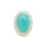 A CABOCHON TURQUOISE AND DIAMOND RING