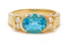 A BLUE TOPAZ AND DIAMOND RING