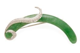 A CURVED JADE AND DIAMOND BROOCH