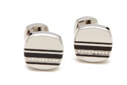 A PAIR OF CHAUMET DIAMOND SET STEEL CUFFLINKS