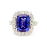 A PLATINUM, TANZANITE AND DIAMOND RING