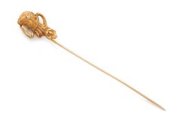 A GOLD FIGURE HEAD PIN