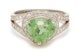 A PERIDOT AND DIAMOND RING