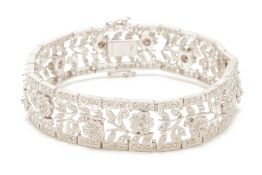 A DIAMOND AND WHITE GOLD FOLIATE BRACELET