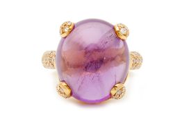 AN CABOCHON AMETHYST AND DIAMOND RING