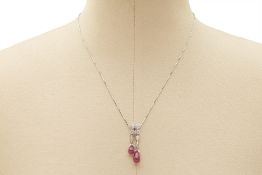 A PLATINUM, RUBY AND DIAMOND PENDANT NECKLACE