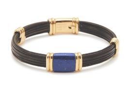 A CHAUMET GOLD AND LAPIS LAZULI BANGLE