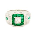 A PLATINUM, EMERALD CUT DIAMOND AND EMERALD RING