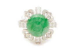 A CABOCHON JADE AND DIAMOND RING