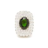 A GOLD, CHROME DIOPSIDE AND DIAMOND RING