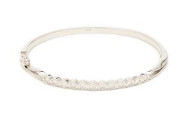 A WHITE GOLD AND DIAMOND BANGLE