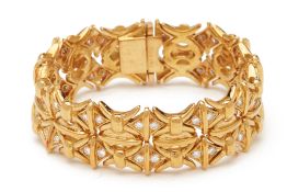 A CHUNKY YELLOW METAL AND DIAMOND BRACELET