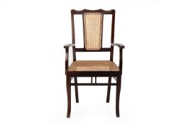 A BERGERE CANED CHAIR