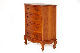 A TEAK CHEST OF DRAWERS