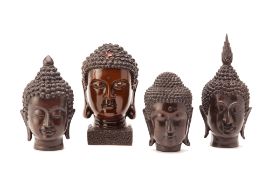 FOUR BUDDHIST BRONZE HEADS