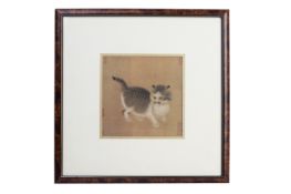 A FRAMED PICTURE OF A KITTEN