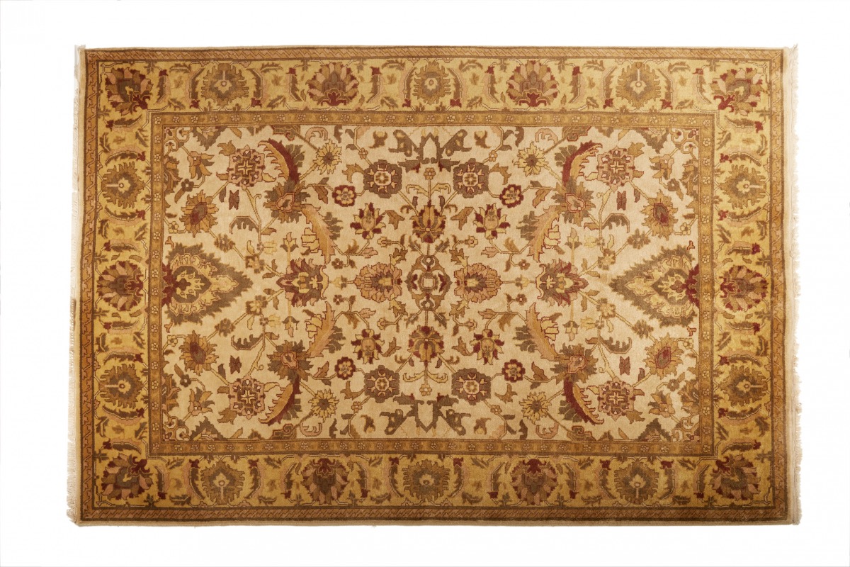 A CREAM FLORAL RUG