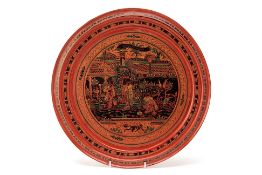 A LACQUER BLACK AND TERRACOTTA PLATTER