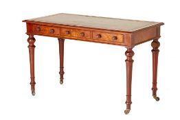 A VICTORIAN WALNUT WRITING TABLE