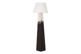 A TALL BLACK AND SILVER LACQUER FLOOR LAMP