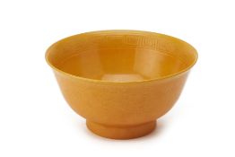 AN INCISED YELLOW GLAZED BOWL