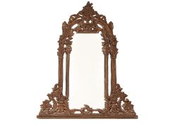 A LARGE CARVED WOODEN MIRROR