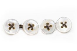 A PAIR OF MOTHER OF PEARL AND SILVER BUTTON CUFFLINKS