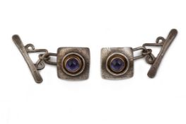 A PAIR OF PURPLE STONE AND SILVER CUFFLINKS