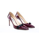 A PAIR OF PRADA BURGUNDY PATENT LEATHER HEELS EU 38