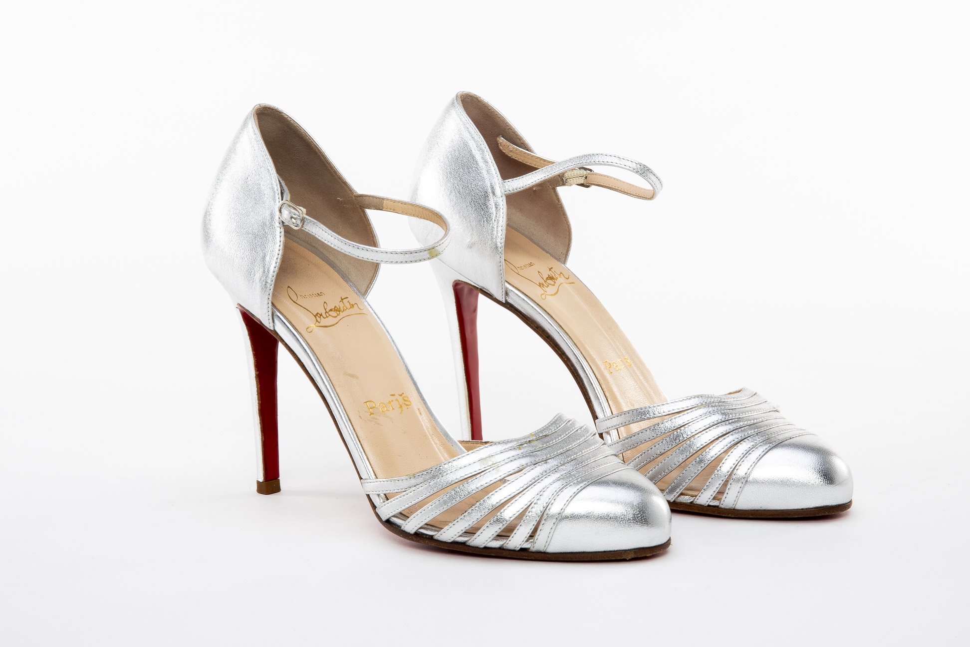 A PAIR OF CHRISTIAN LOUBOUTIN SILVER STRAPPY HEELS EU 38.5