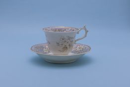 A ROCKINGHAM CUP AND SAUCER AND ANOTHER