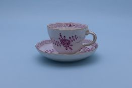 A MEISSEN TEA CUP AND SAUCER