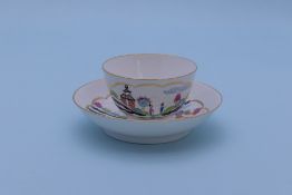 A WORCESTER 'STAG HUNT' PATTERN TEA BOWL AND SAUCER