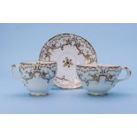 THREE GILT DECORATED TRIOS