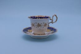 A GROUP OF THREE CUPS AND SAUCERS