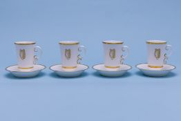 A SET OF FOUR ROYAL WORCESTER CHOCOLATE CUPS AND SAUCERS
