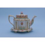 A POLYCHROME TEAPOT AND STAND