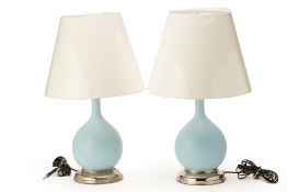 A PAIR OF BLUE GLAZED BOTTLE FORM TABLE LAMPS