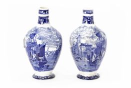 A PAIR OF WEDGEWOOD BLUE AND WHITE PRINTED DECANTERS