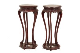 A PAIR OF ORIENTAL CARVED JARDINIERE STANDS