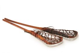 A PAIR OF VINTAGE LACROSSE STICKS